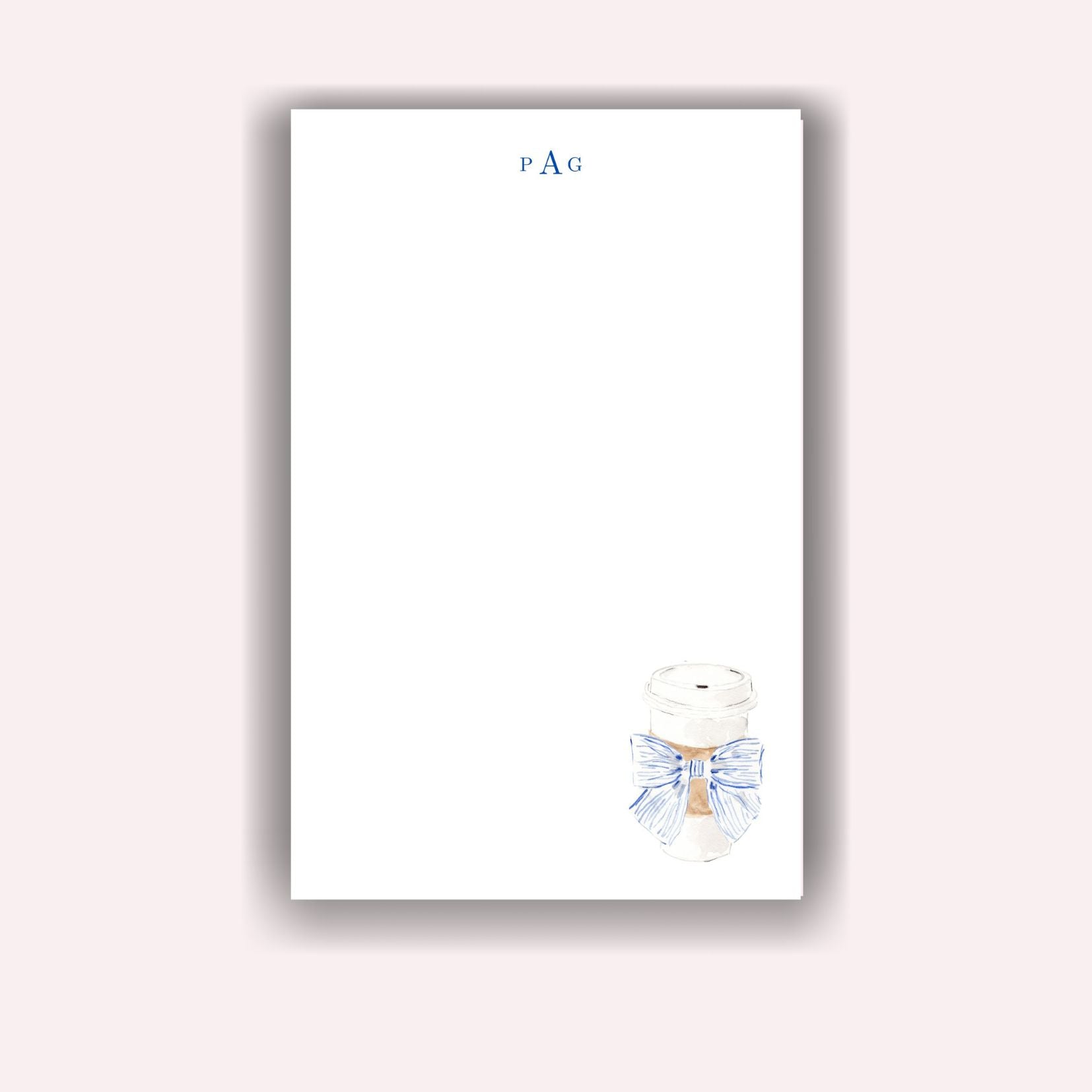 Hot Coffee with Blue Bow on Notepad