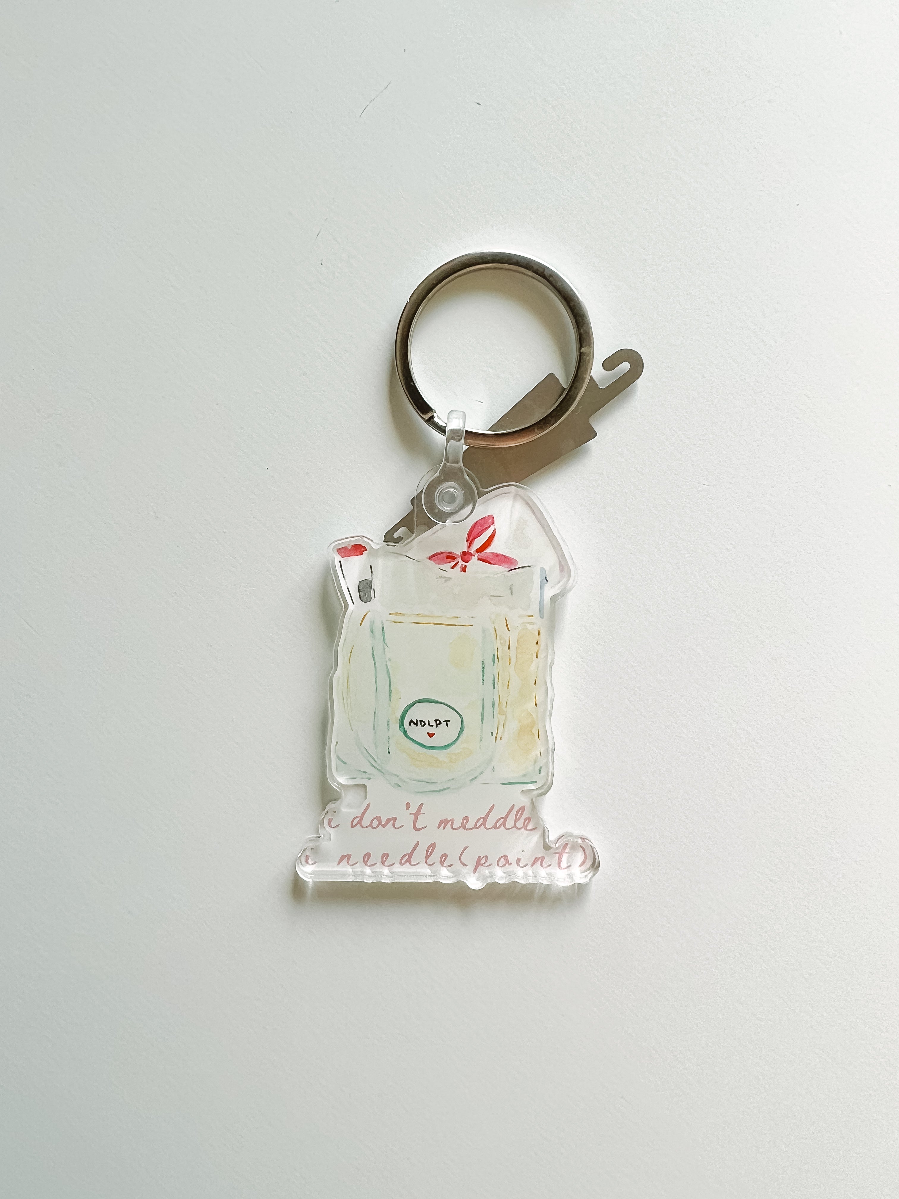 Stash bag keychain with detachable needle threader for needlepoint