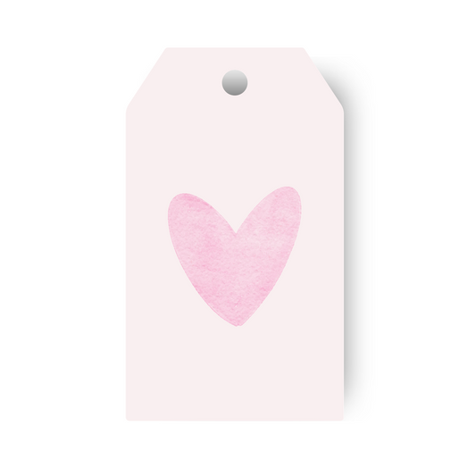 Pink heart gift tag on light pink background