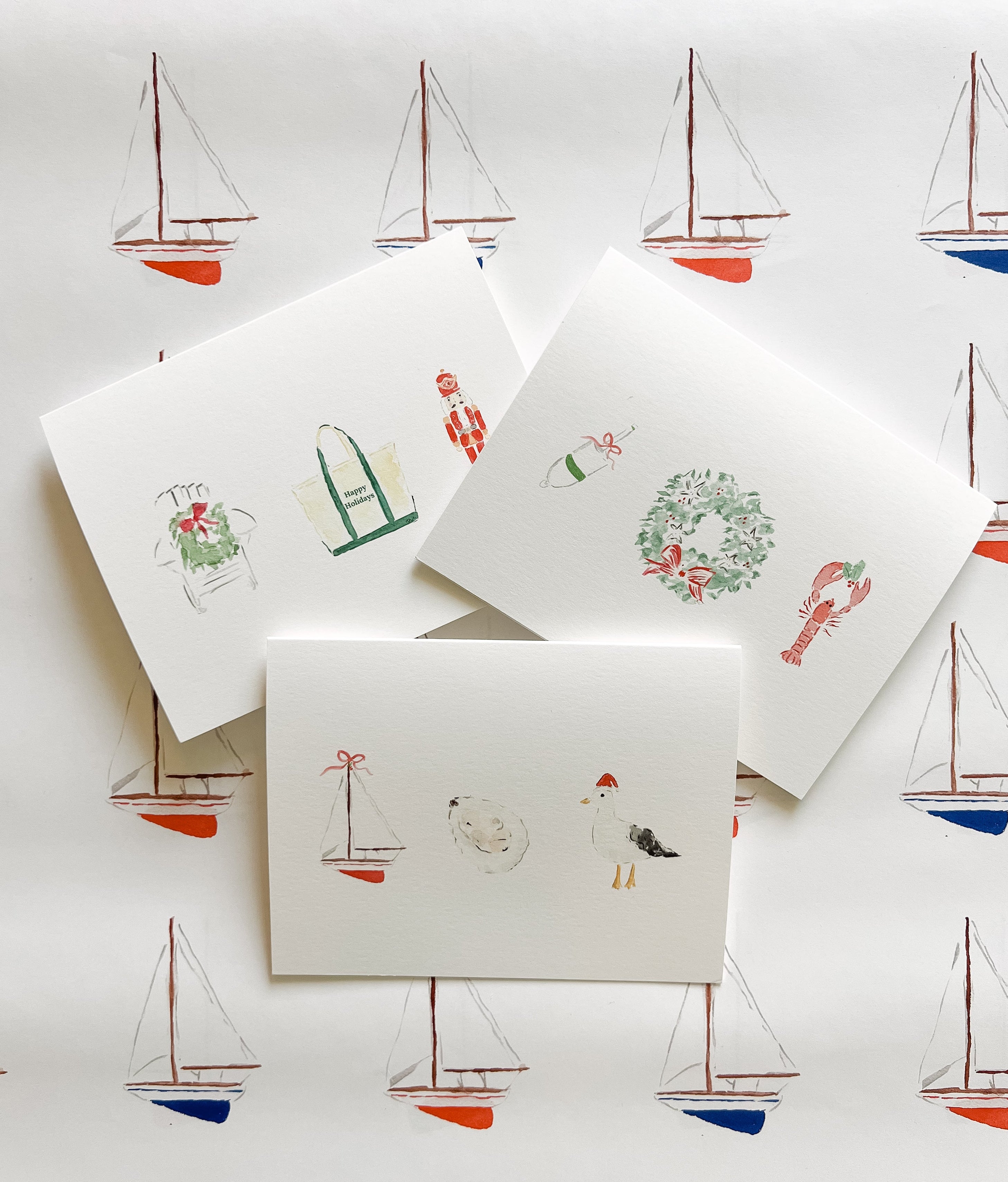 Set of greeting cards with illustrations on a background with sailboat patterns