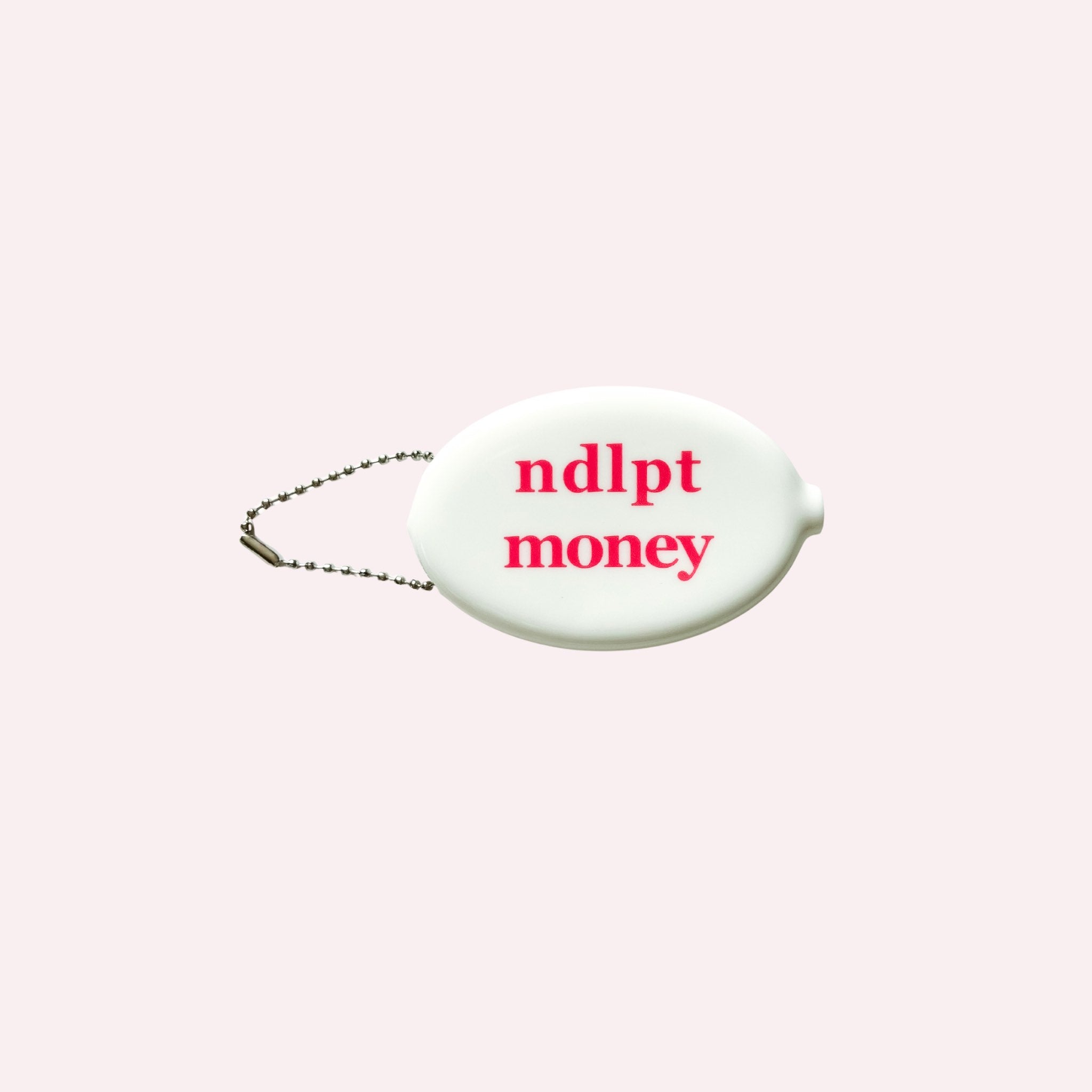 White oval tag with 'ndlpt money' text on a light pink background