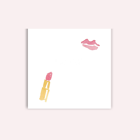 Lipstick and lipstick kiss on a white notepad