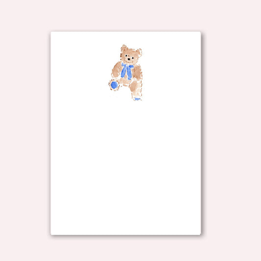 Notepad with teddy bear wearing blue bow