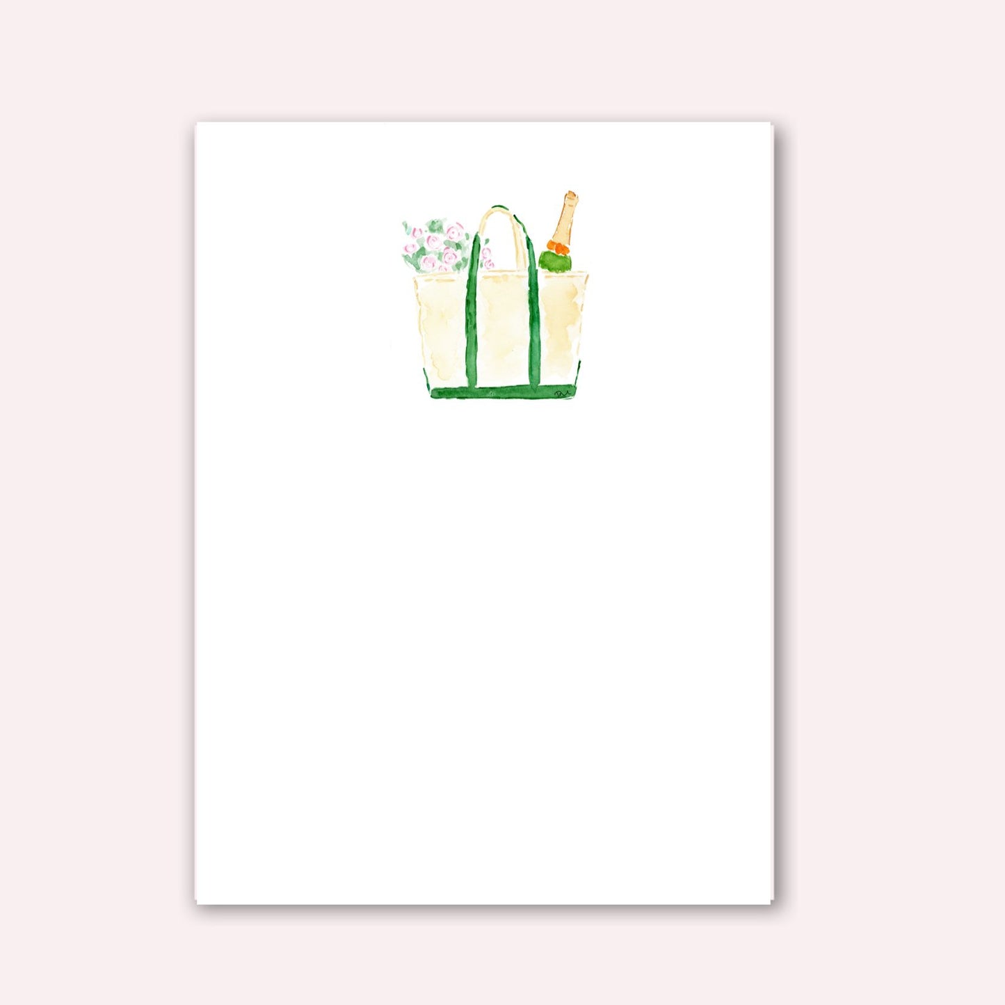 Notepad with tan boat and tote bag with green handles with flowers and champagne