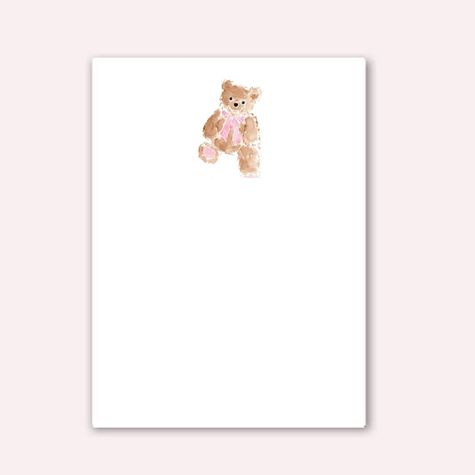 Notepad with teddy bear wearing pink bow